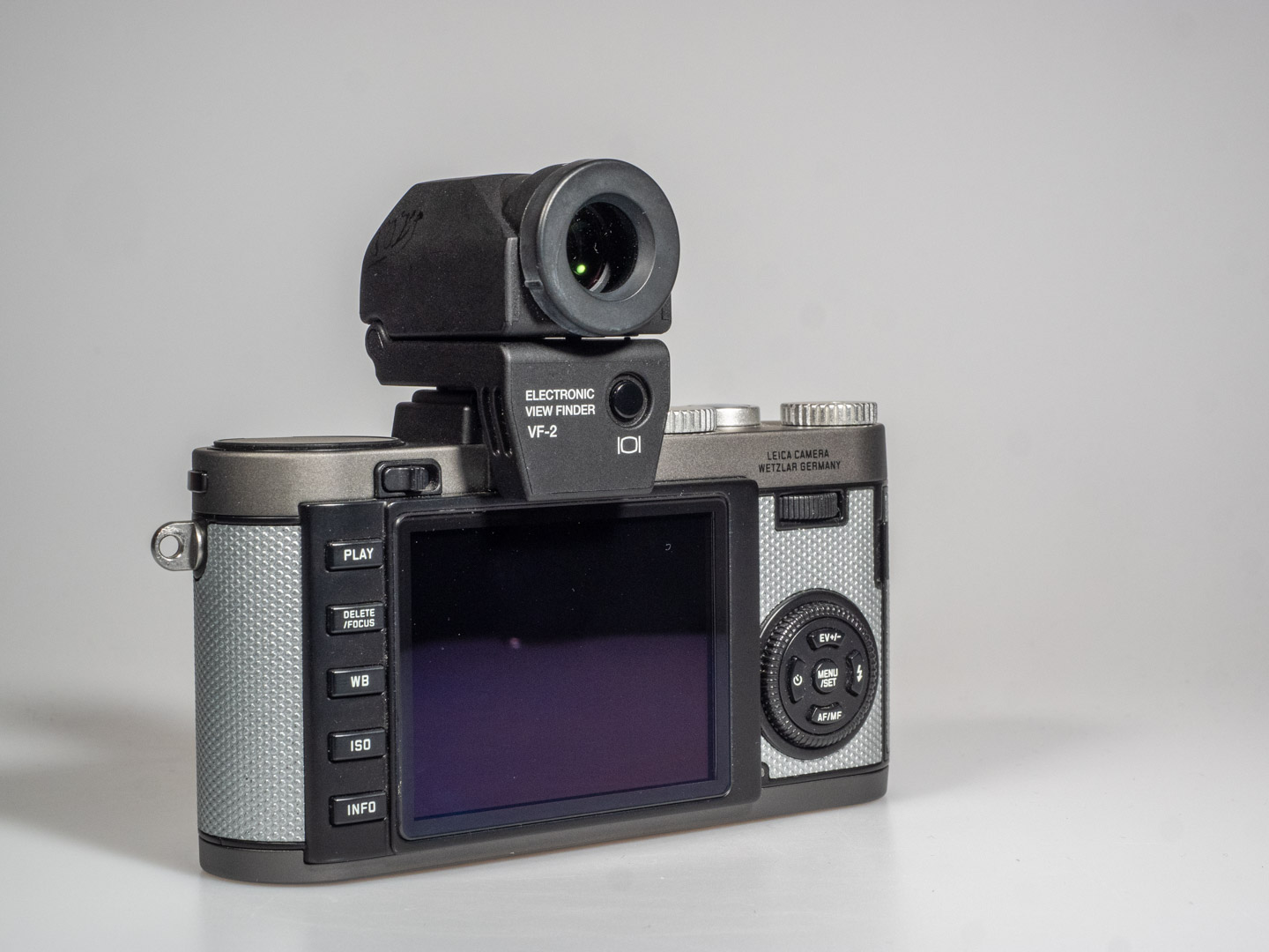 Images shows a Leica X-E camera with Olympus electronic viewfinder VF-2 mounted.