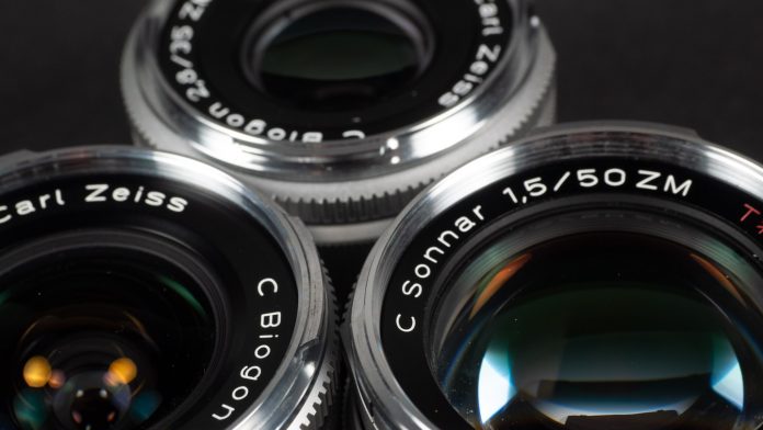 OLYMPUS DIGITAL CAMERA Product image shows Zeiss ZM C lenses, Biogon 21/4.5; Biogon 35/2.8; Sonnar 50/1.5