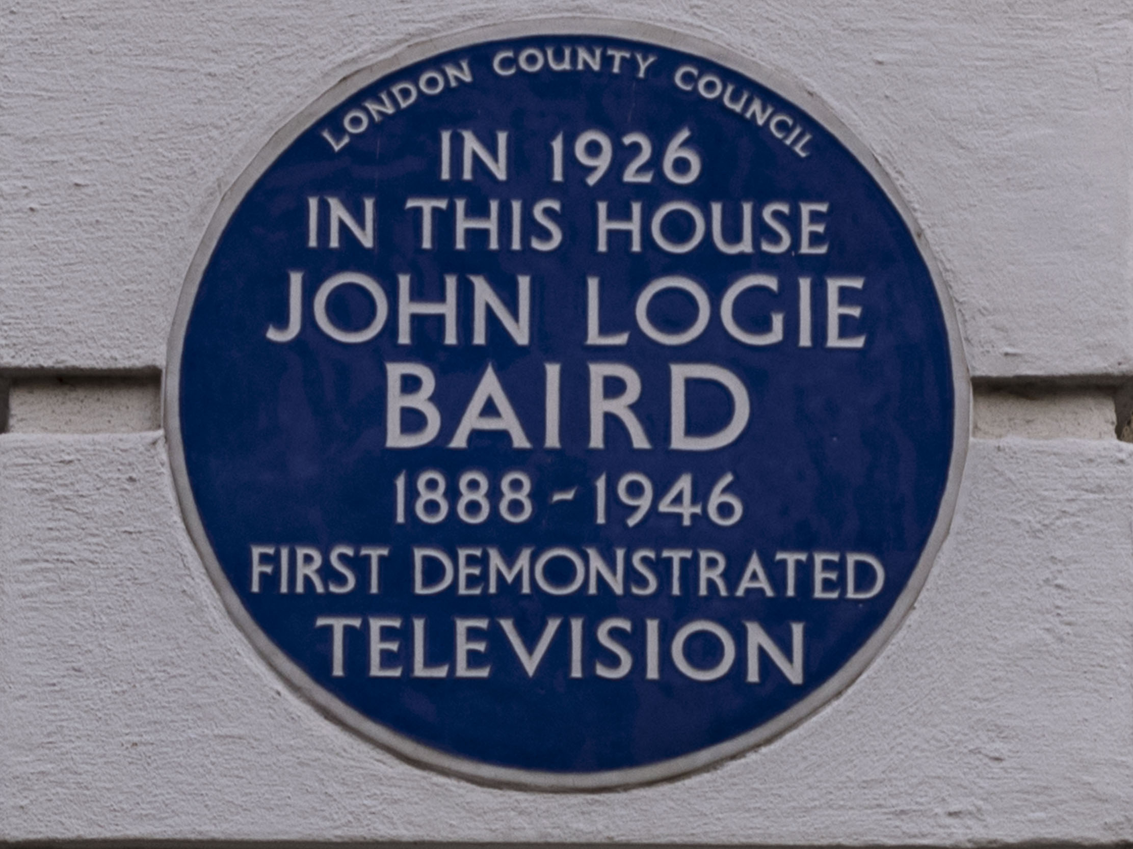 A blue plaque commemorating John Logie Baird at 22 Frith Street, London, noting that he first demonstrated television in 1926.