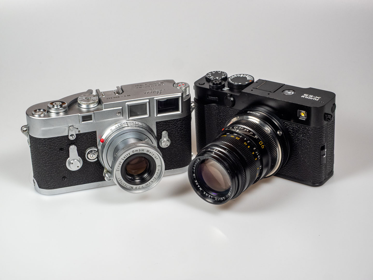 Leica vs. Fujifilm: Product image shows Leica M3 and Fujifilm X-E5.