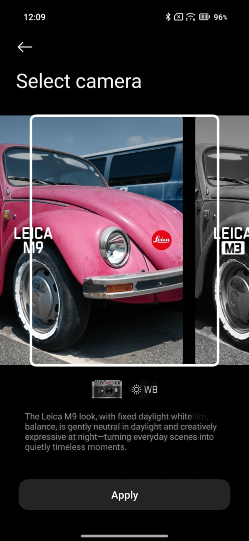 A pink Volkswagen Beetle is prominently displayed on the left side of the screen. The image showcases a camera selection interface with the 'Leica M9' and 'Leica M3' options. The background features a blue van and a bright sky.