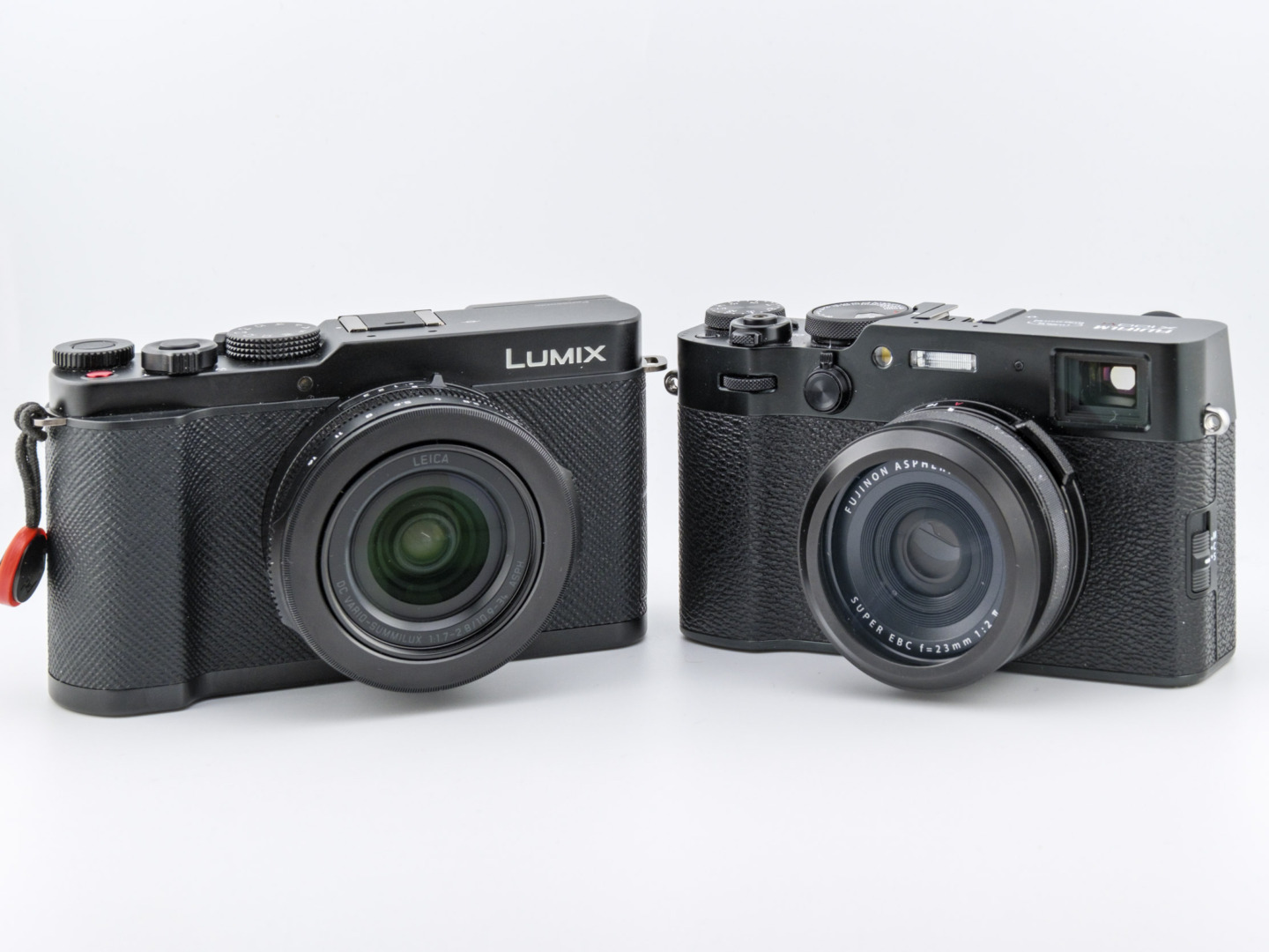 A Panasonic Lumix L10 and a Fujifilm X100VI side by side.