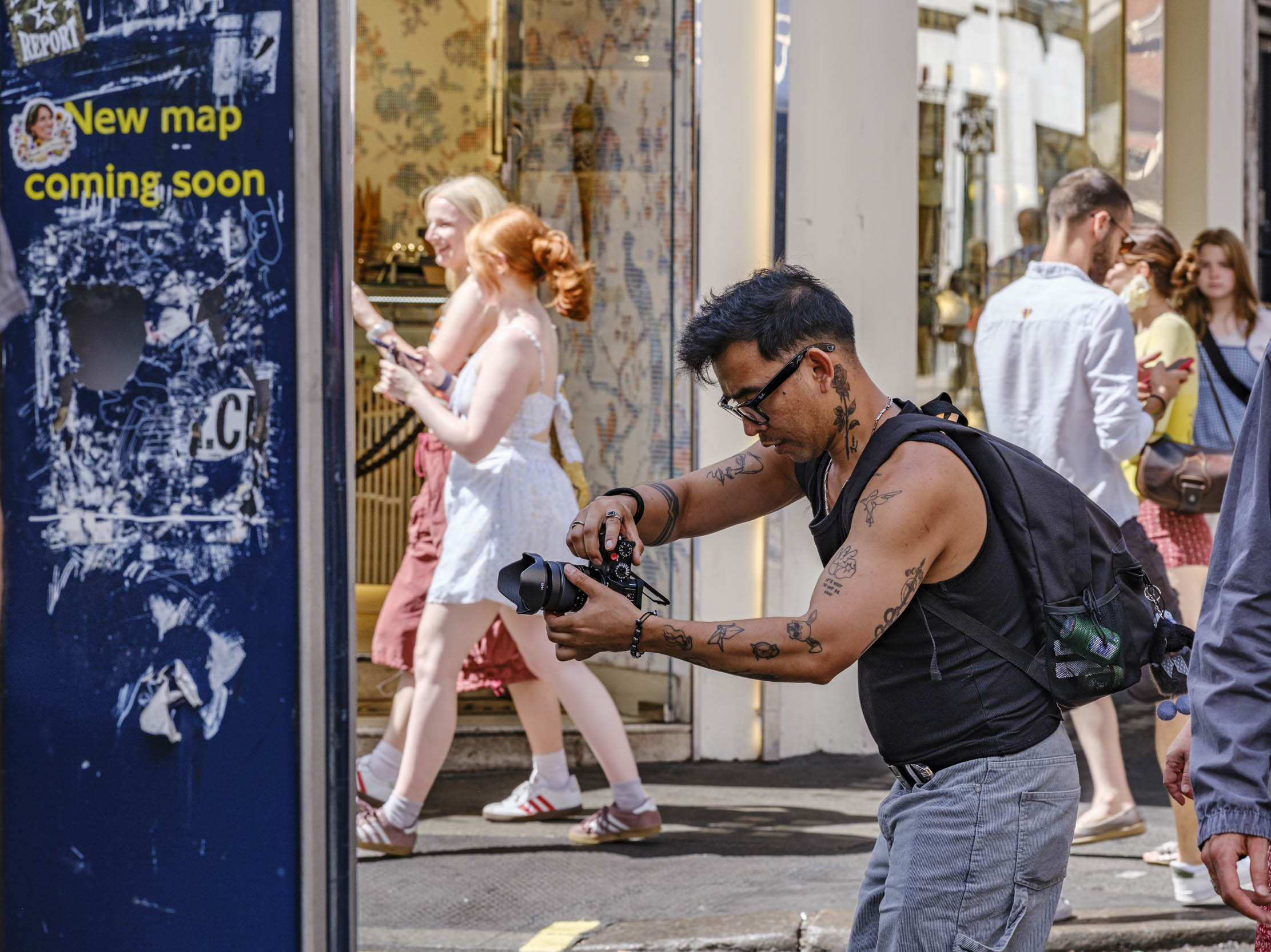 Man taking photo with Fuji camera
