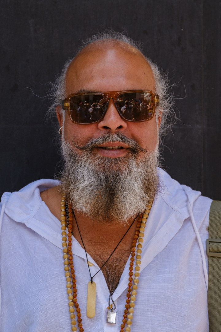 Man with beard and neck beads