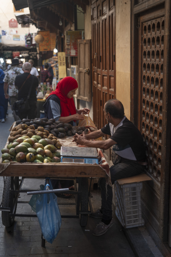 shopkeeper and customer in Fez