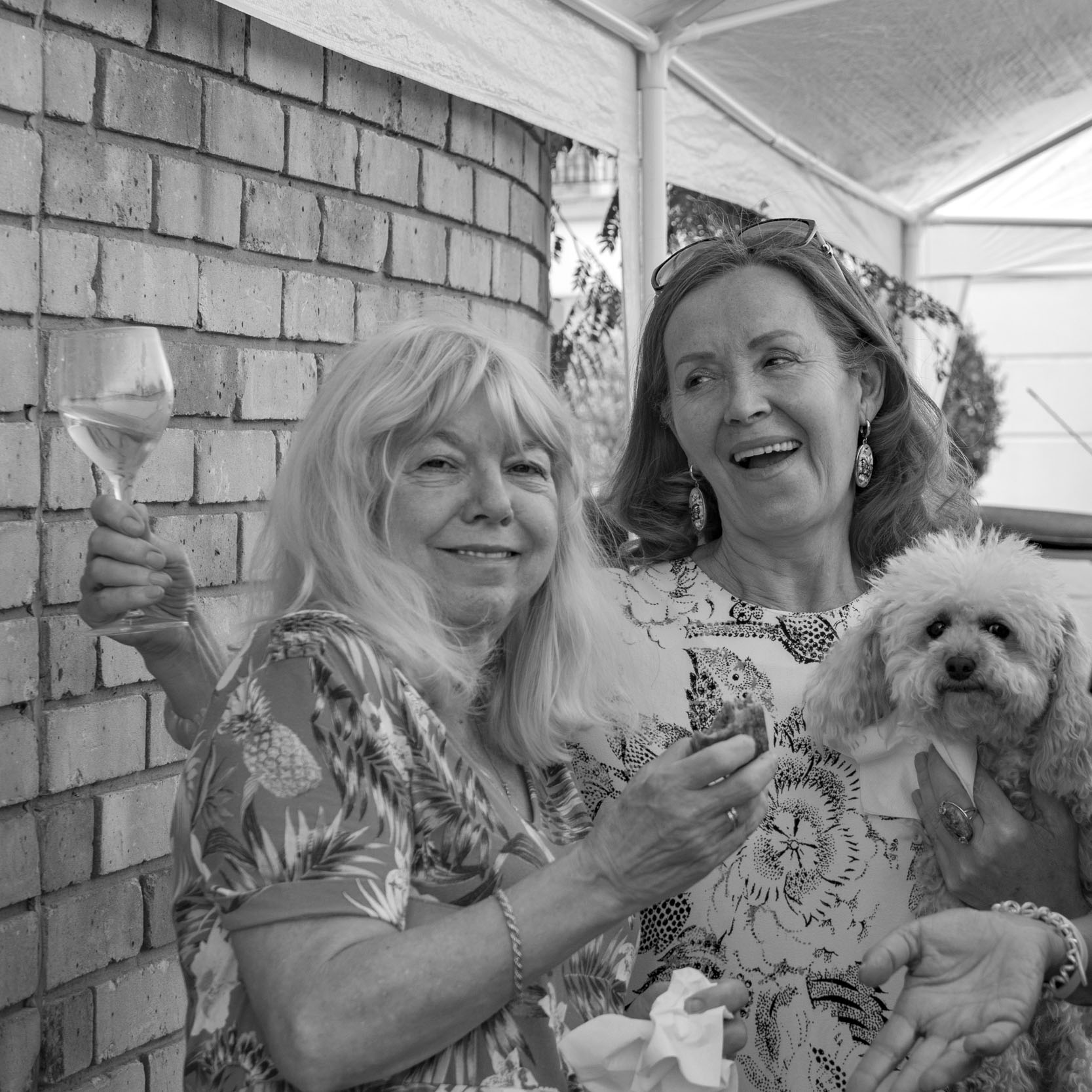 Two ladies and dog, at party