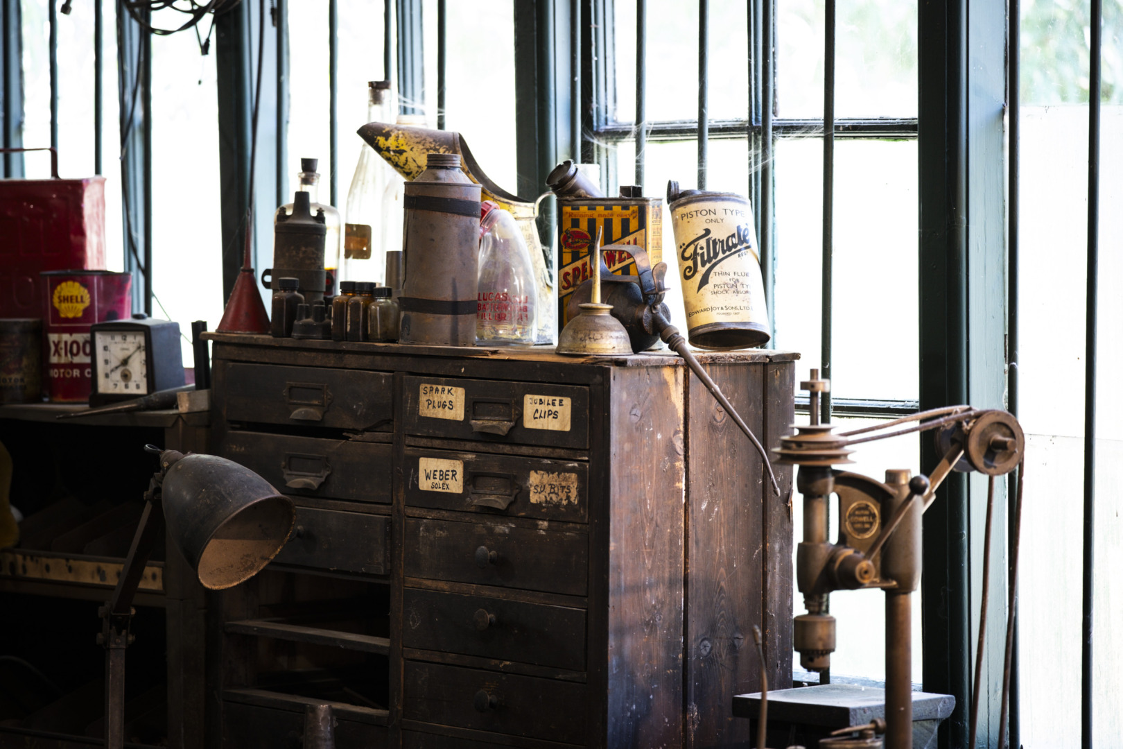 Old workshop with cans of oil and tools
