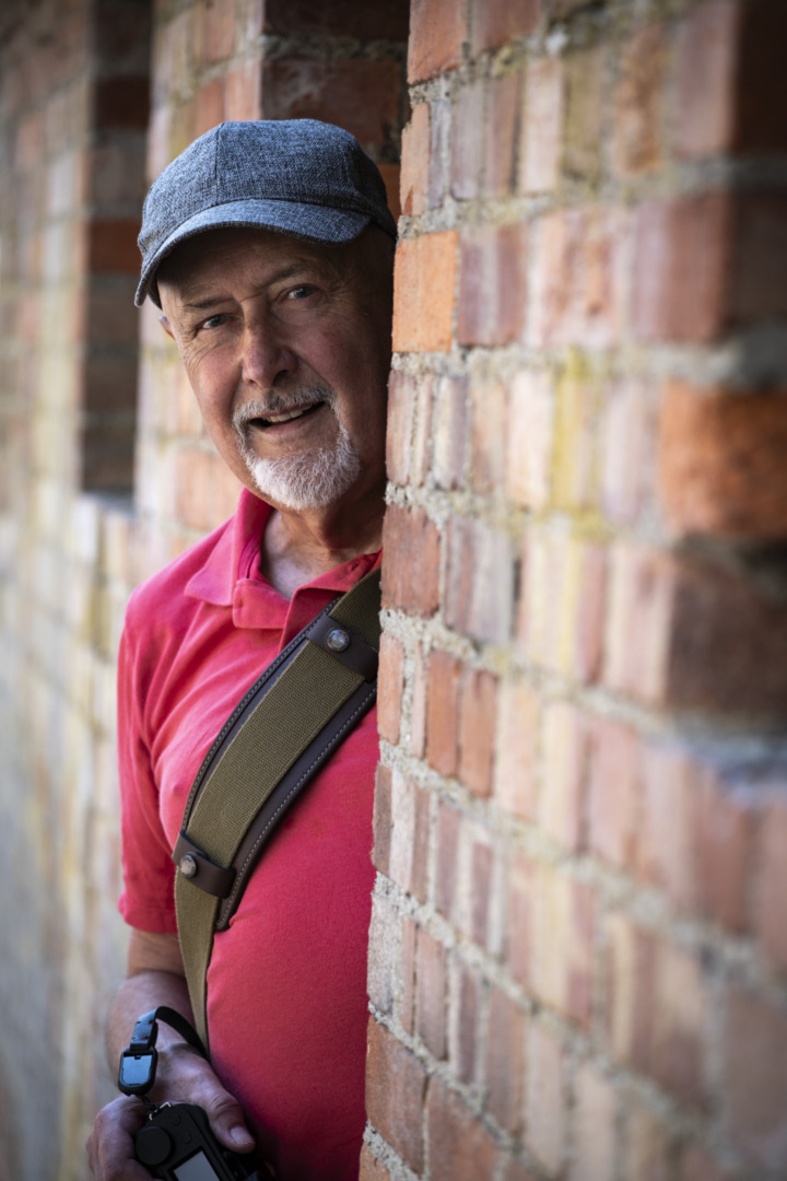 Man with camera standing in doorway