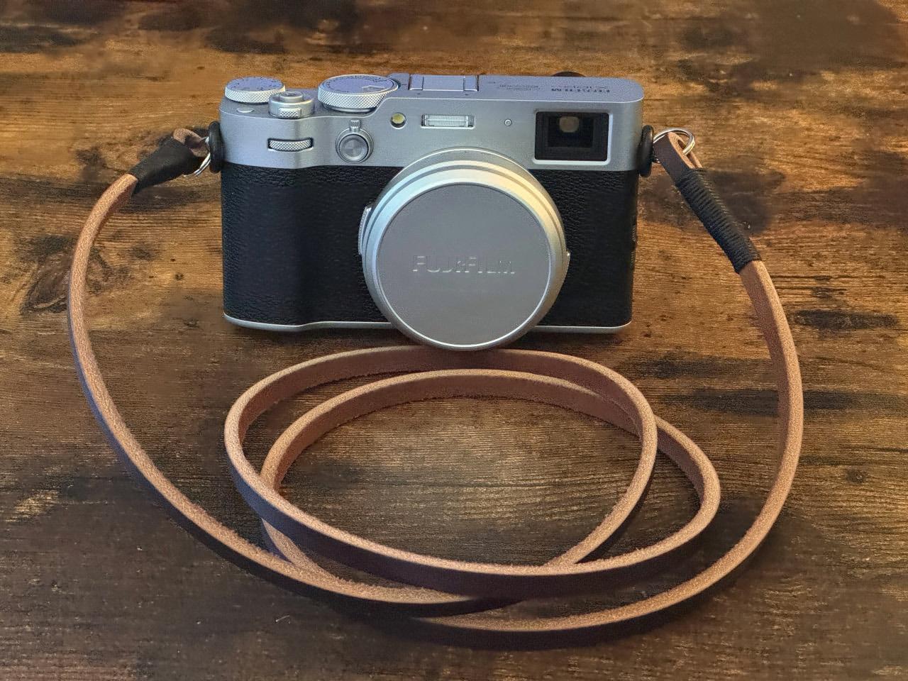 Camera with rawhide leather strap
