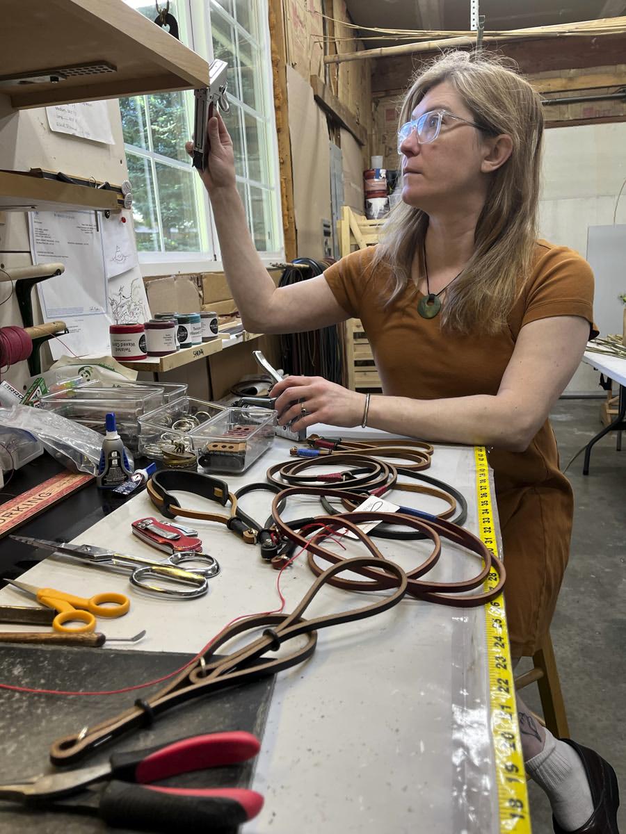 Woman manufacturing camera wrist straps