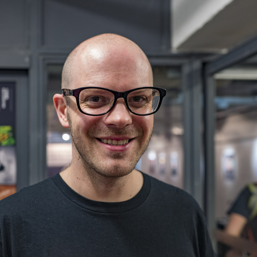 portrait of man with black glasses