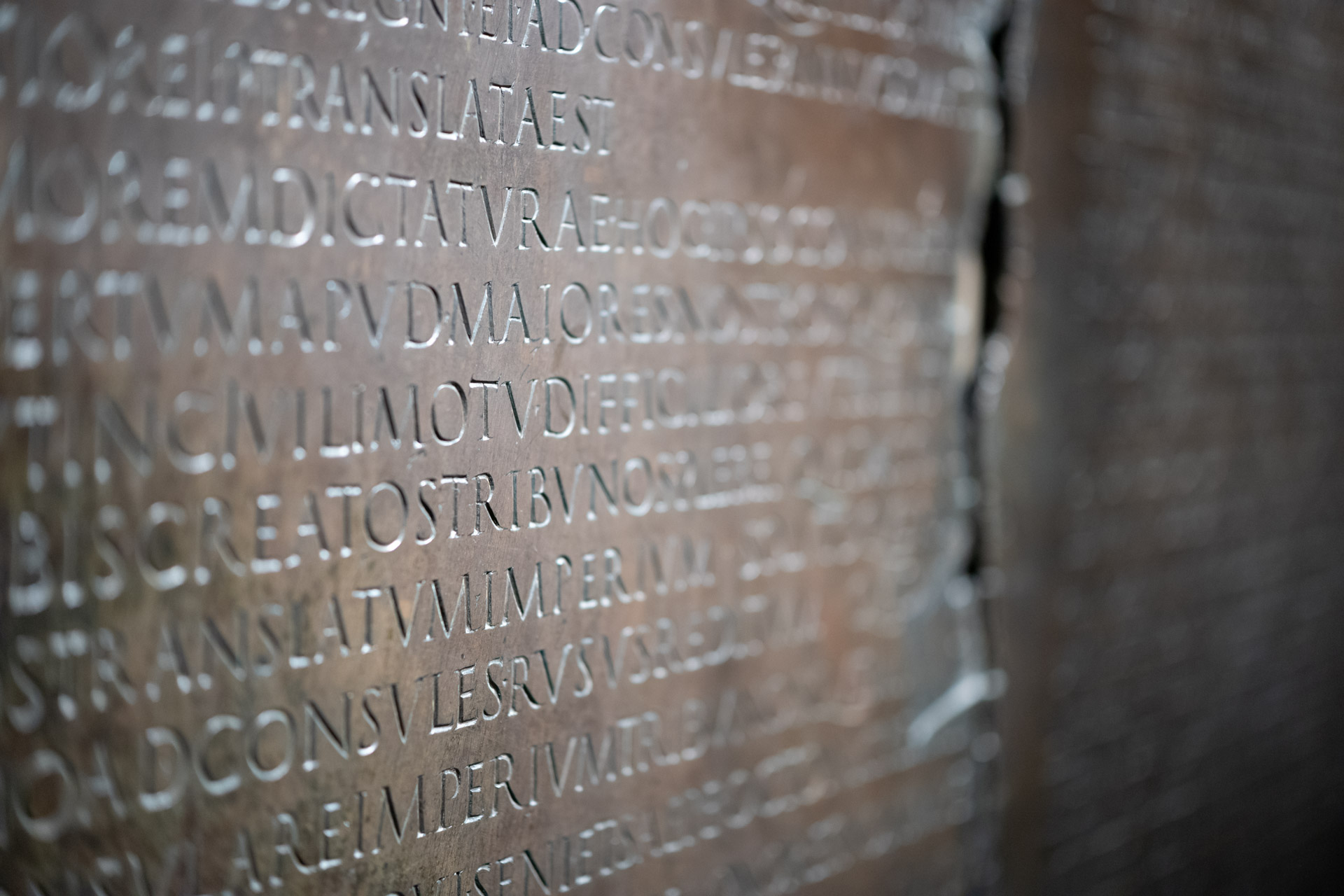 Sample shot with Thypoch Simera 50/1.4: close-up of the Latin inscription on a Roman bronze tablet, likely the Table Claudienne, Musée gallo-romain de Fourvière, Lyon.