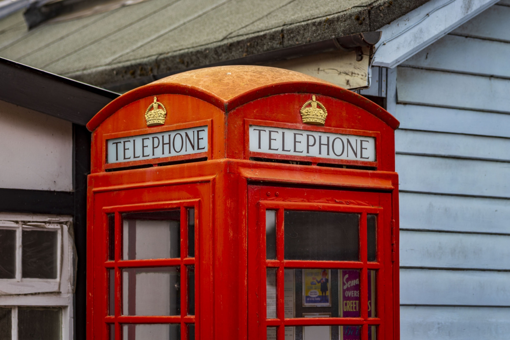 Close-up of a red British telephone box at Brooklands
