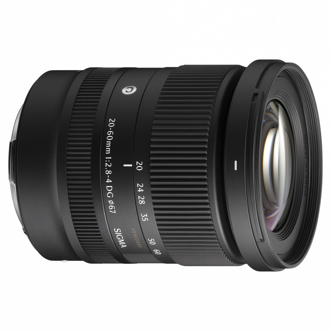 Three-quarter view of the Sigma 20-60mm lens with its front element and hood visible, against a white background.