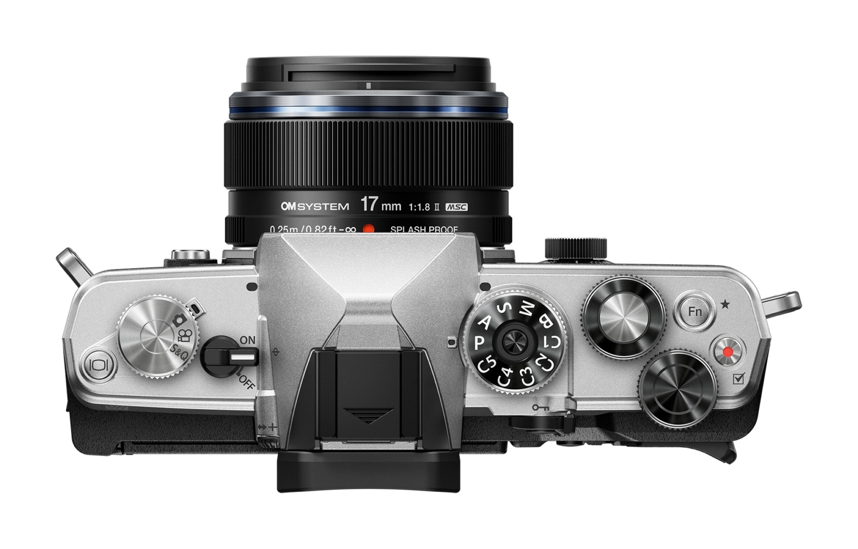 Top view of a silver camera with a 17mm lens, featuring various dials and buttons for settings adjustment.