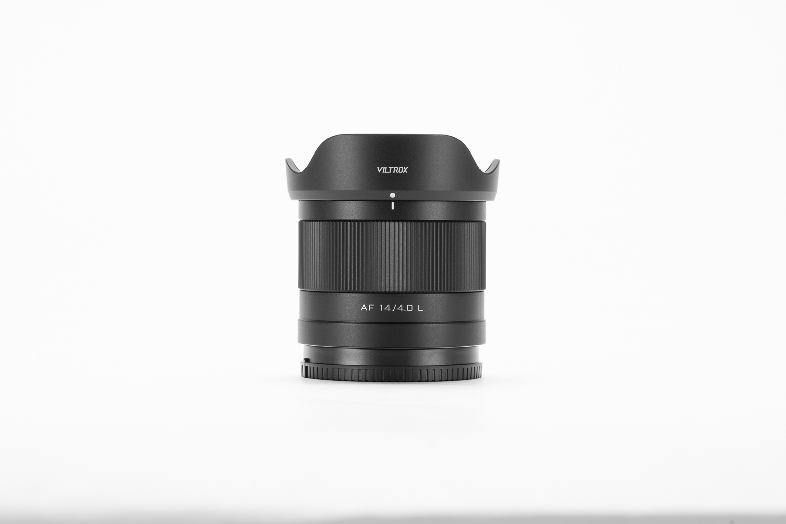 Front view of a Viltrox AF 14/4.0 L camera lens with a lens hood on a white background.