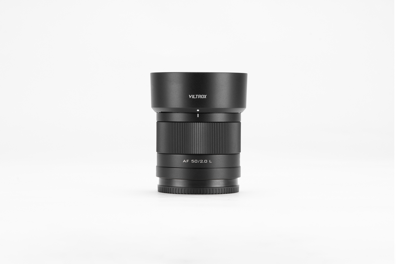 A black Viltrox AF 50mm f/2.0 lens with a lens hood, displayed against a white background.