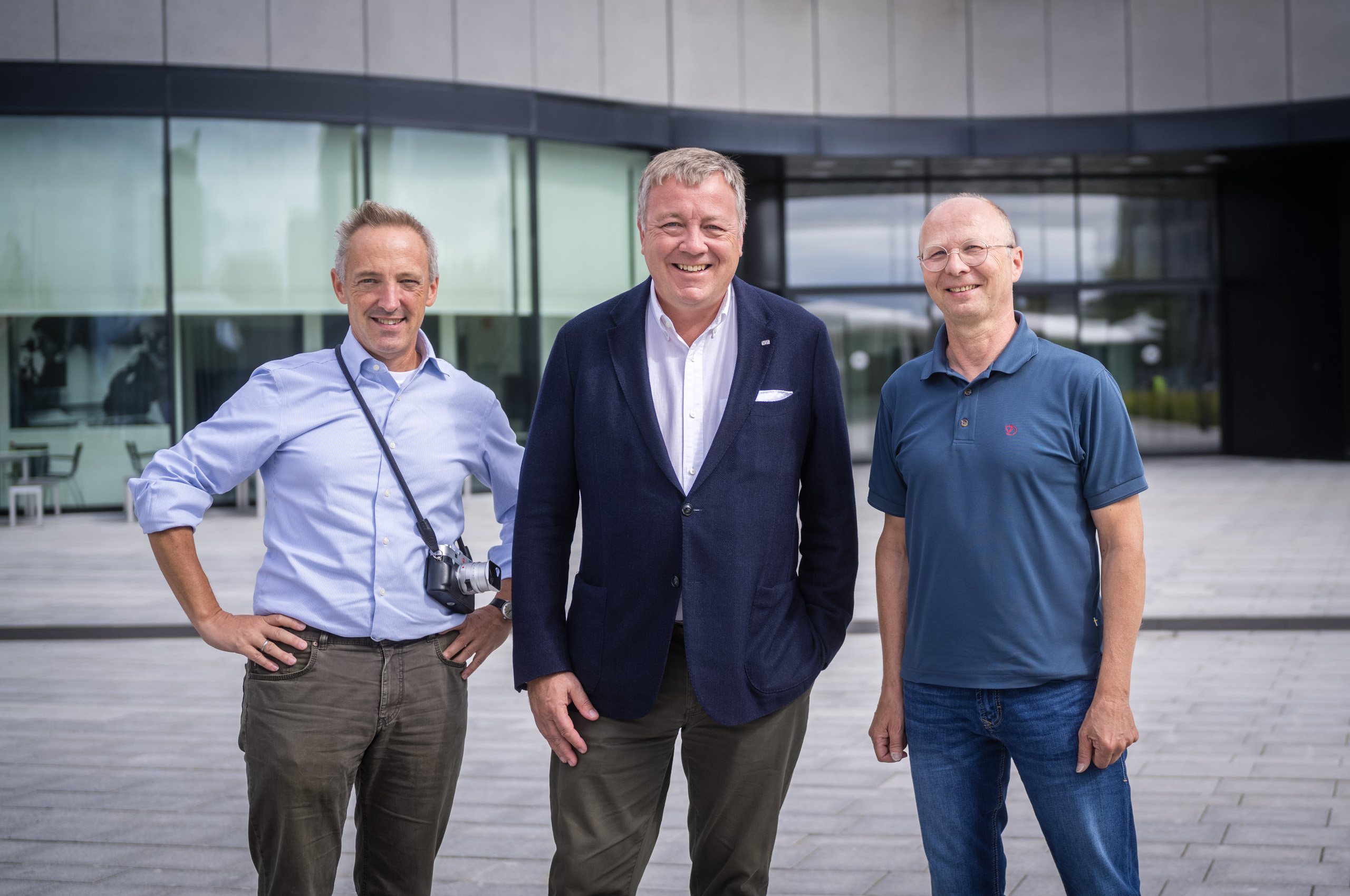 Leica Wetzlar visit: Jörg-Peter Rau, Stefan Daniel and Claus Sassenberg (l-r) standing together outside the Leica Campus building.