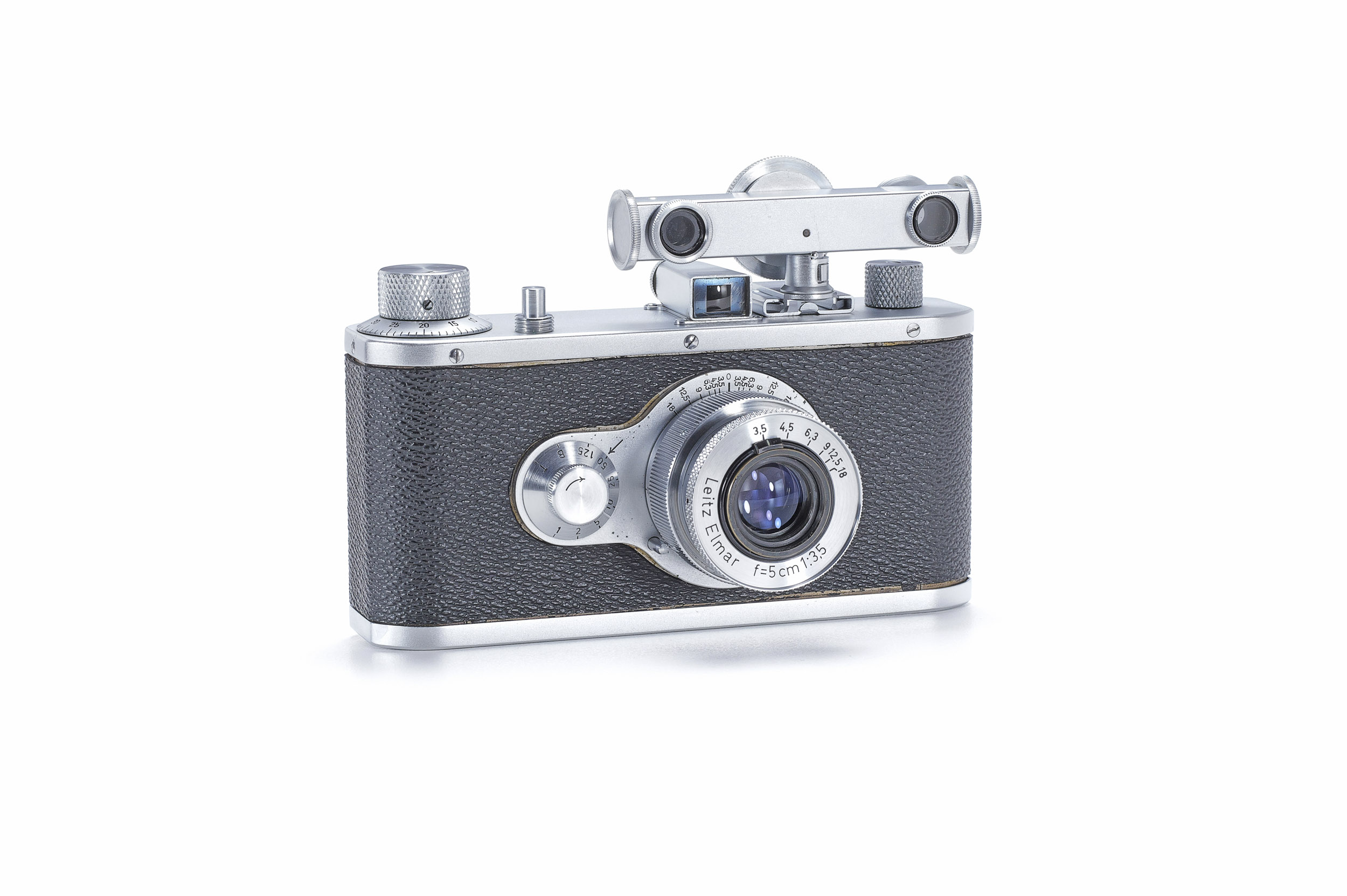 A chrome and black Leitz prototype camera with an Elmar lens, a shutter dial on the front plate and a separate rangefinder mounted on top.
