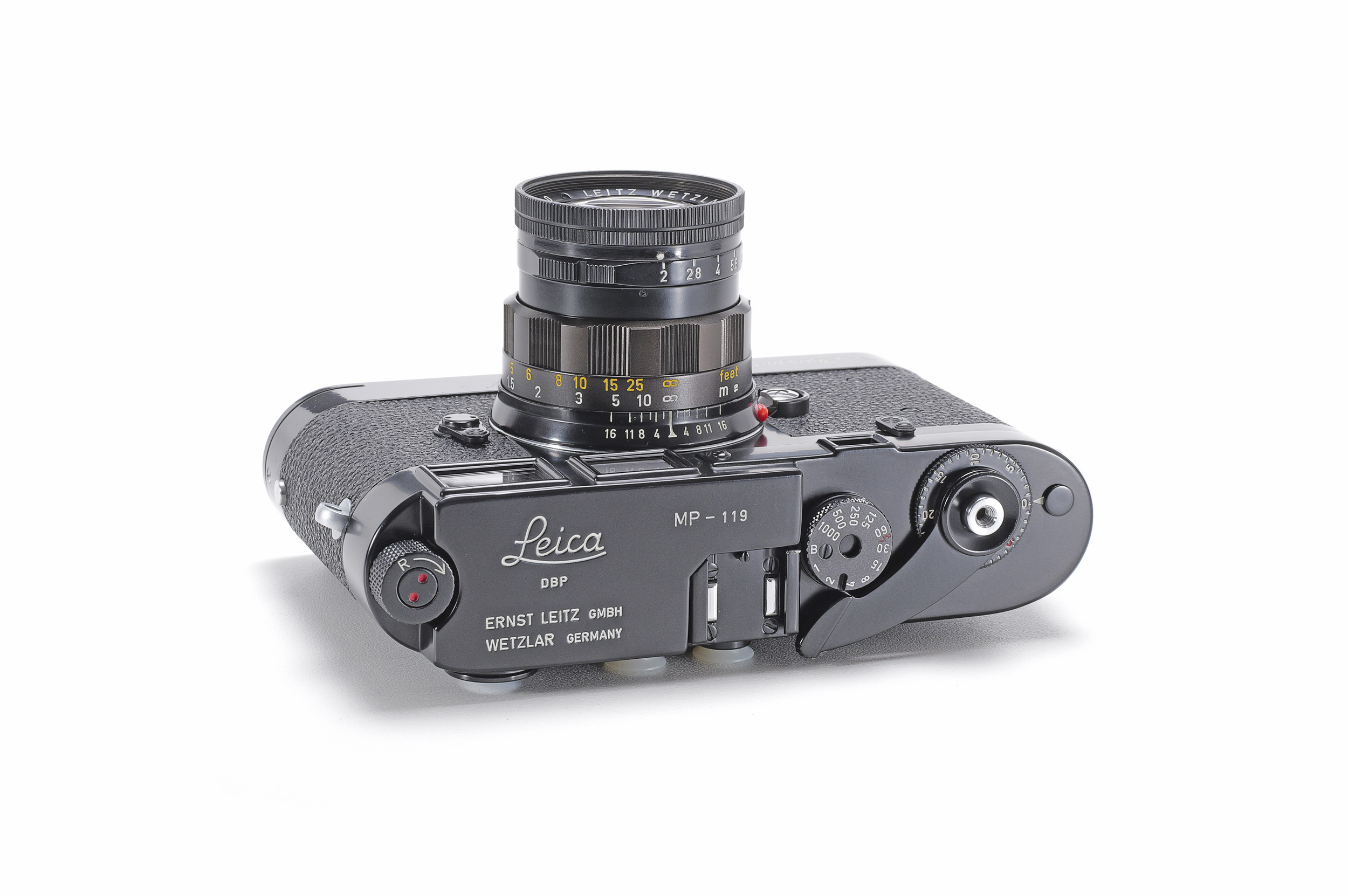 Top view of a glossy black-paint Leica MP engraved MP-119, fitted with a black Summicron lens.
